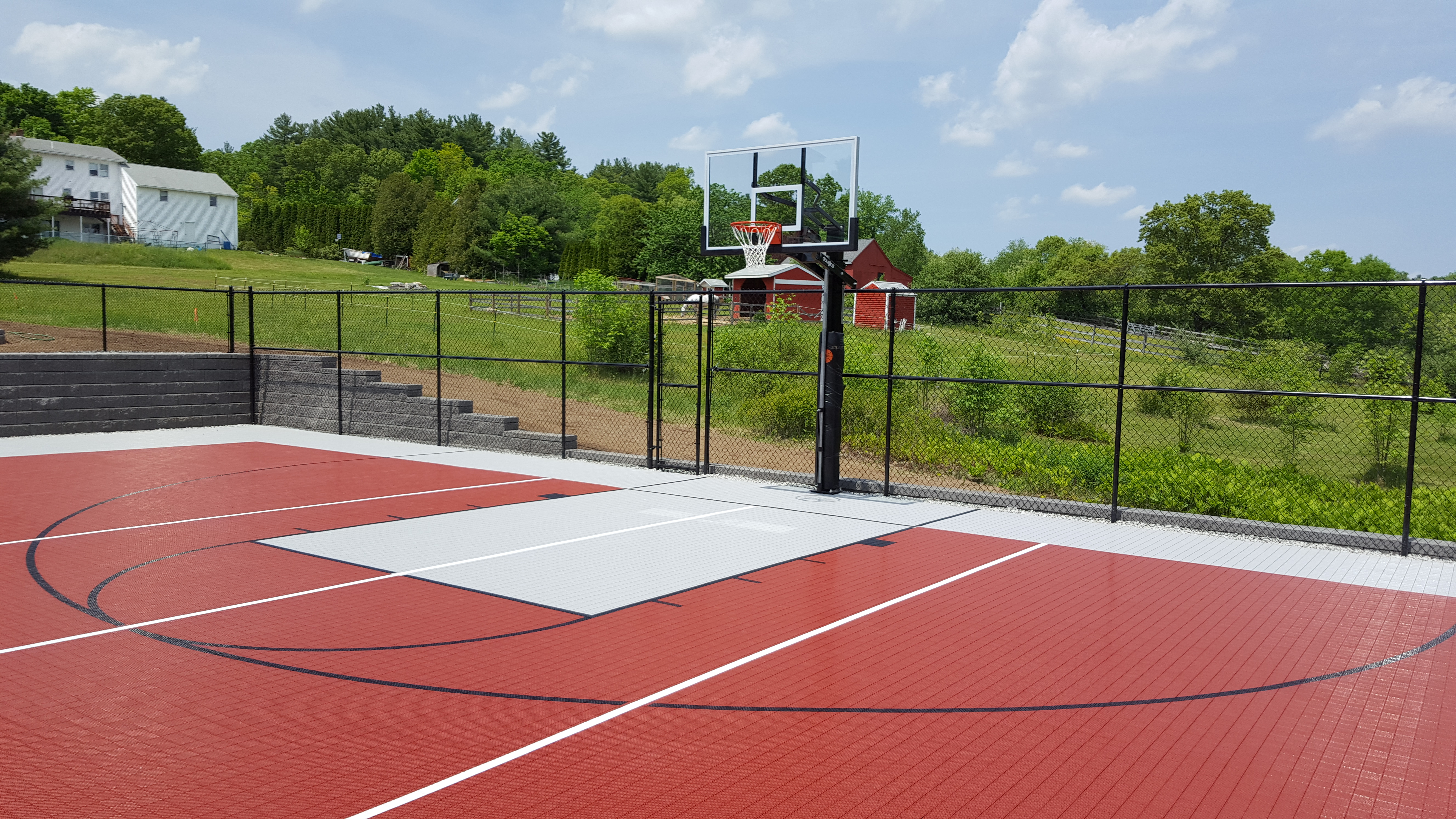 A combination Volleyball and Basketball Court in a Residential Backyard Space