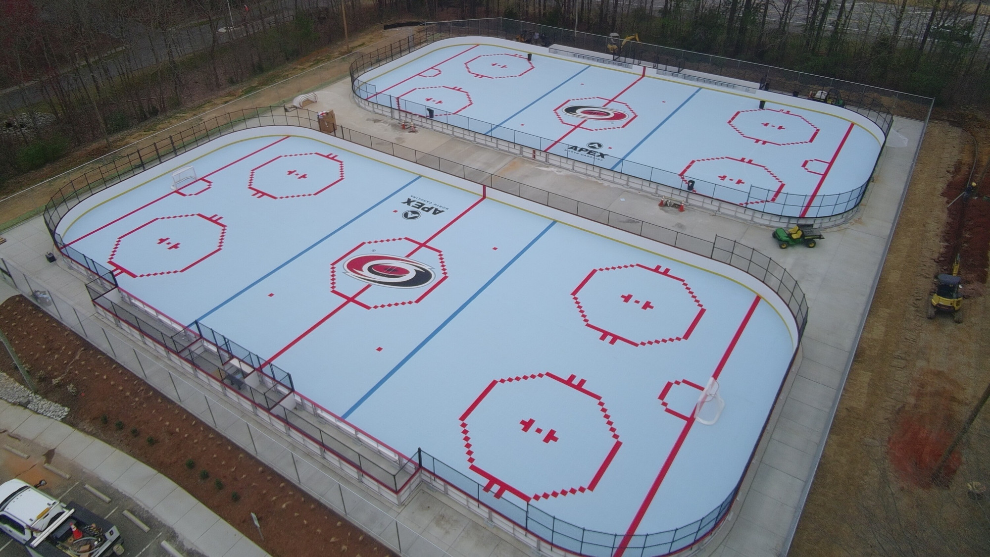 Two Ice Blue, Royal Blue and Bright Red Custom Outdoor Inline Hockey Rinks with Mateflex III Tile for the Carolina Hurricanes in Apex, NC